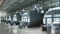 The image shows large boilers.