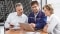 The image shows a service employee during a consultation.